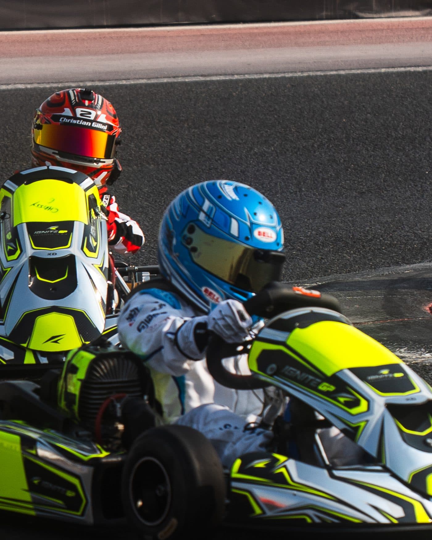 Two Ignite GP Bambino karts side by side through a corner